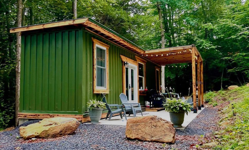 McFadden Ridge green container home with porch built on