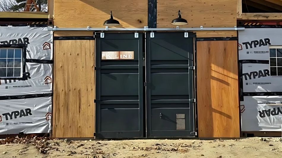 Two black doors added to shipping container build