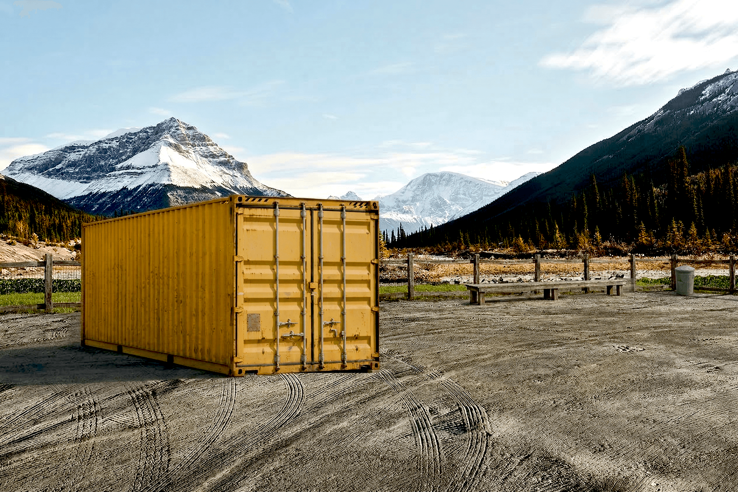 Yellow container in the Midwest with snowy mountains in the distance