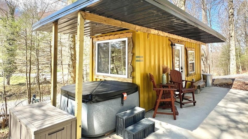 Shipping container home with plumbing and hot tub