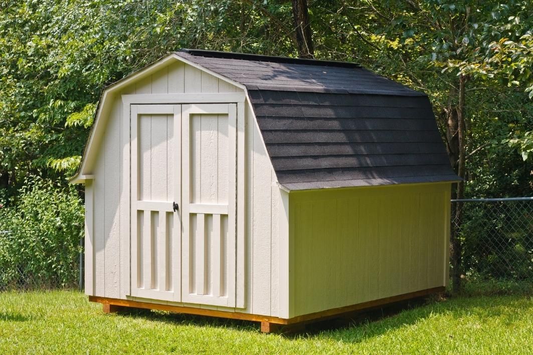 White prefabricated shed with front doors