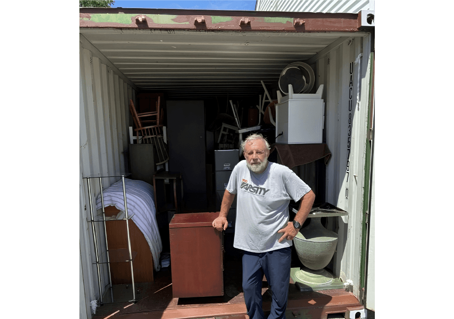 Man filling container at Saint Peter's Lutheran Church with donations and furniture