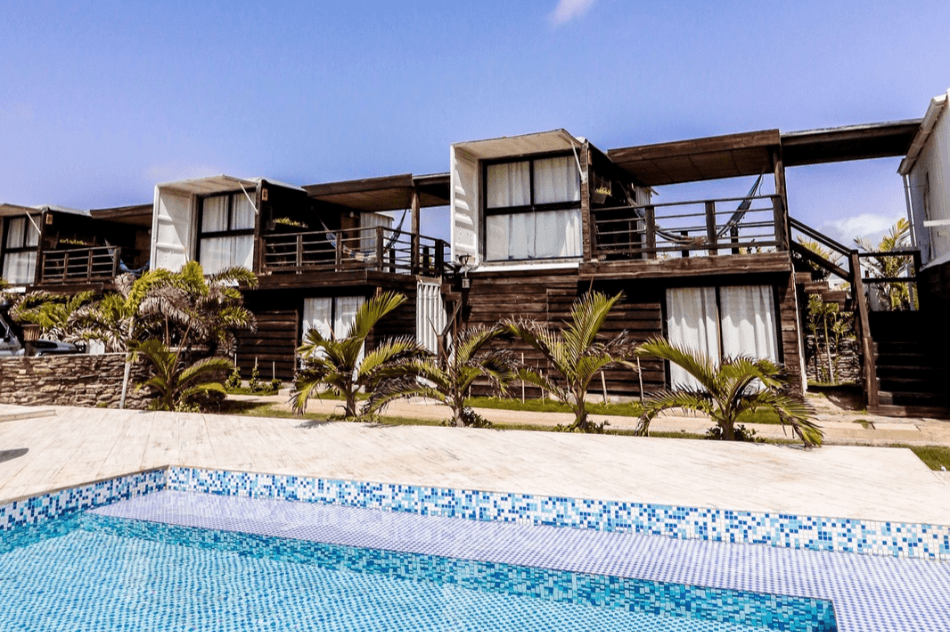hotel made out of shipping containers next to pool