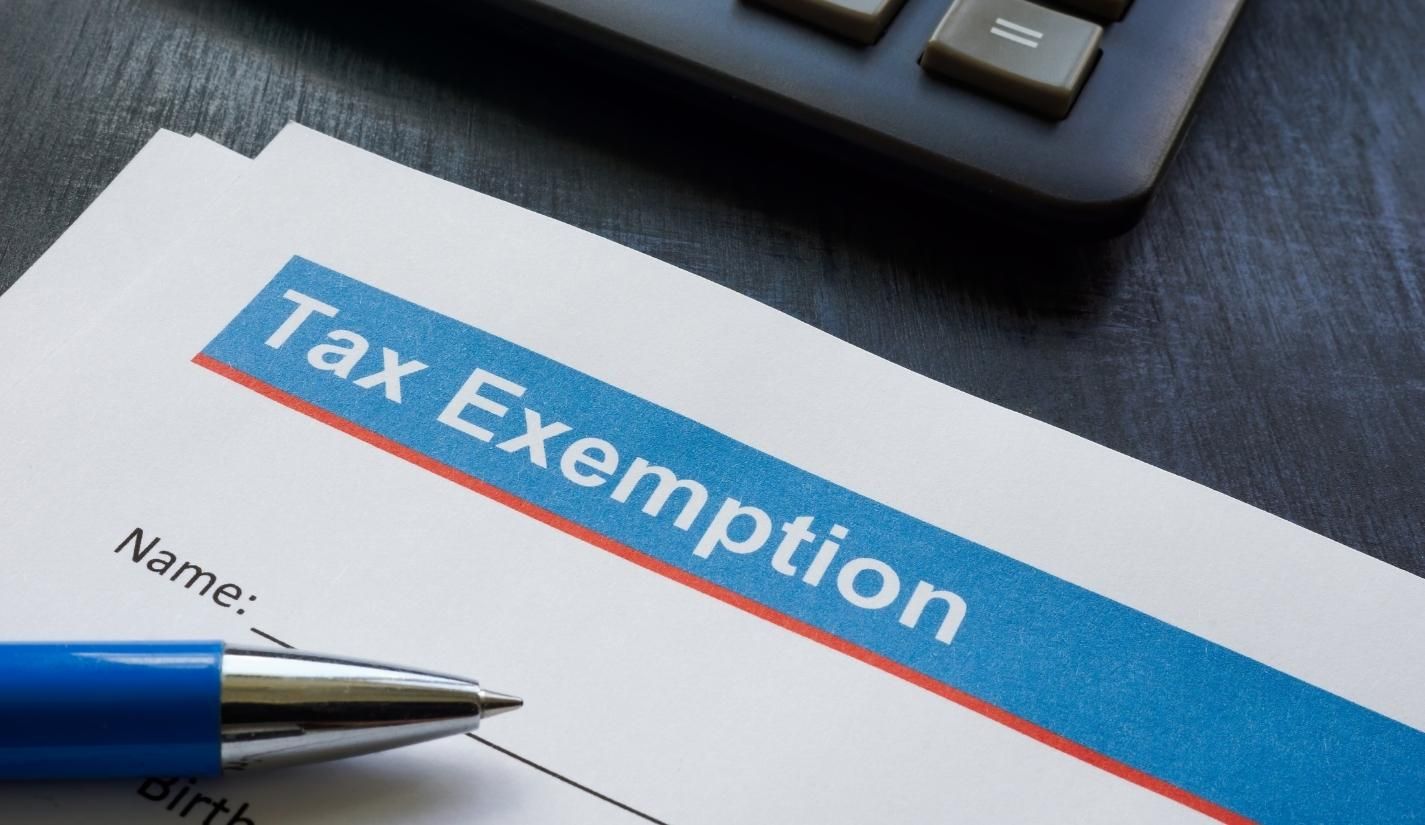 Tax Exemption form next to pen and keyboard