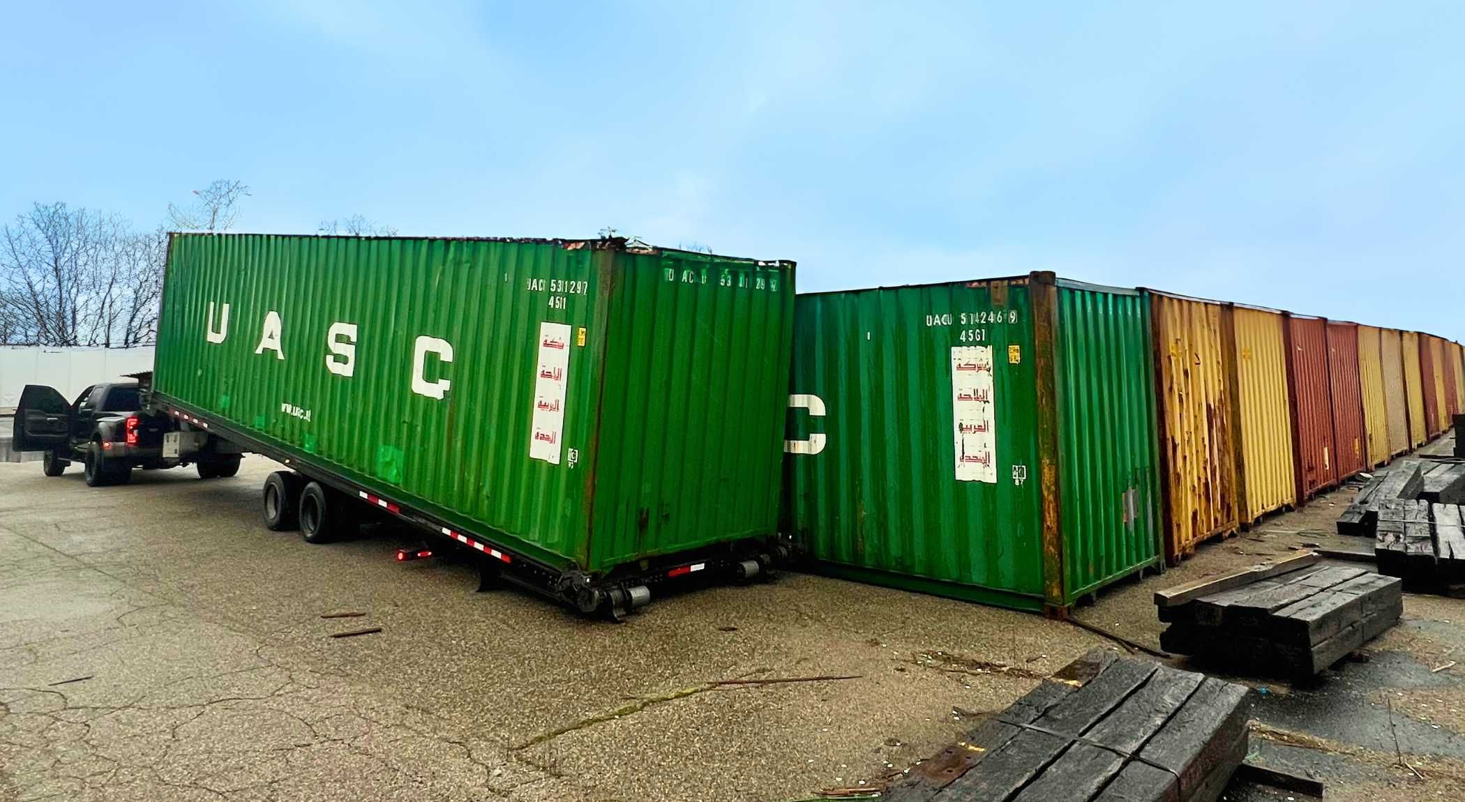 Bulk container order delivered by tiltbed truck