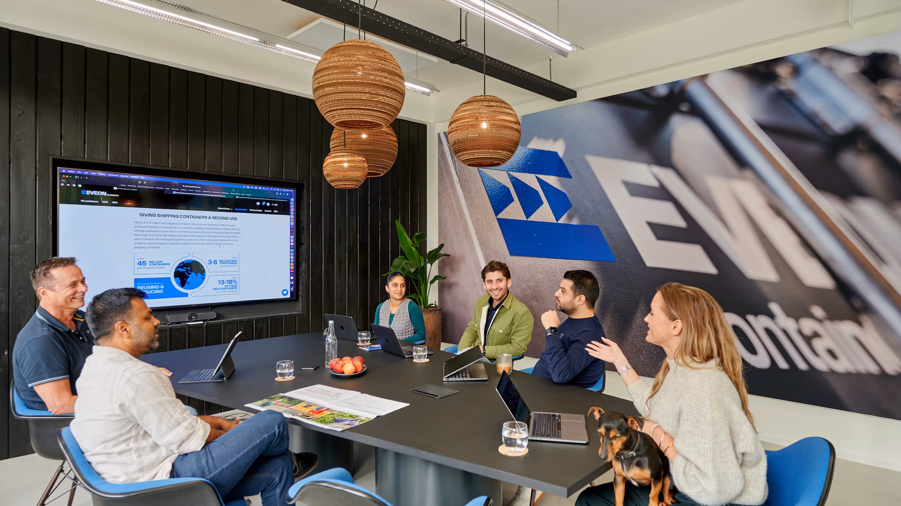 Eveon Containers team in the office discussing shipping containers